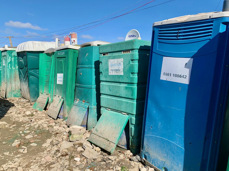 People empty poo buckets in road as toilet dispute festers | GroundUp